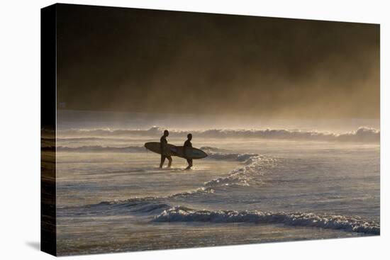 Surfers Make their Way to the Ocean Camburi Beach at Sunrise-Alex Saberi-Stretched Canvas