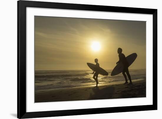 Surfers on Bloubergstrand at sunset, Cape Town, Western Cape, South Africa, Africa-Ian Trower-Framed Photographic Print