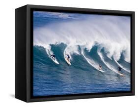 Surfers Ride a Wave at Waimea Beach on the North Shore of Oahu, Hawaii-null-Framed Stretched Canvas