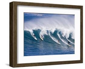 Surfers Ride a Wave at Waimea Beach on the North Shore of Oahu, Hawaii-null-Framed Photographic Print