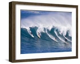 Surfers Ride a Wave at Waimea Beach on the North Shore of Oahu, Hawaii-null-Framed Photographic Print