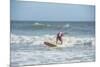 Surfing Santas, Cocoa Beach, Florida, USA-Lisa Engelbrecht-Mounted Photographic Print