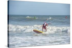 Surfing Santas, Cocoa Beach, Florida, USA-Lisa Engelbrecht-Stretched Canvas