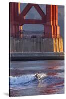 Surfing under the Golden Gate Bridge, San Francisco, California, USA-Chuck Haney-Stretched Canvas