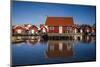 Sweden, Bohuslan, Kungshamn, red fishing shacks in the Fisketangen, old fisherman's neighborhood-Walter Bibikow-Mounted Photographic Print