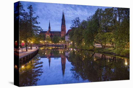 Sweden, Central Sweden, Uppsala, Domkyrka Cathedral, reflection, dusk-Walter Bibikow-Stretched Canvas