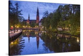 Sweden, Central Sweden, Uppsala, Domkyrka Cathedral, reflection, dusk-Walter Bibikow-Stretched Canvas