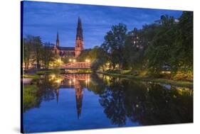 Sweden, Central Sweden, Uppsala, Domkyrka Cathedral, reflection, dusk-Walter Bibikow-Stretched Canvas