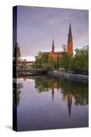 Sweden, Central Sweden, Uppsala, Domkyrka Cathedral, reflection, dusk-Walter Bibikow-Stretched Canvas