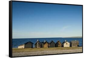 Sweden, Faro Island, Kursviken, coastal farmers fishing shacks, sunset-Walter Bibikow-Framed Stretched Canvas