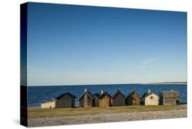 Sweden, Faro Island, Kursviken, coastal farmers fishing shacks, sunset-Walter Bibikow-Stretched Canvas