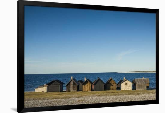 Sweden, Faro Island, Kursviken, coastal farmers fishing shacks, sunset-Walter Bibikow-Framed Photographic Print