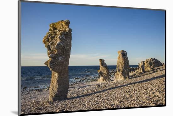 Sweden, Faro Island, Langhammars Area, Langhammar coastal limestone rauk rock, sunset-Walter Bibikow-Mounted Photographic Print