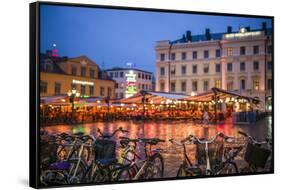 Sweden, Linkoping, cafes and bars on Stora target square, dusk-Walter Bibikow-Framed Stretched Canvas
