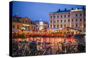 Sweden, Linkoping, cafes and bars on Stora target square, dusk-Walter Bibikow-Stretched Canvas