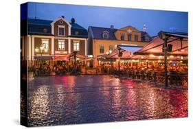 Sweden, Linkoping, cafes and bars on Stora target square, dusk-Walter Bibikow-Stretched Canvas