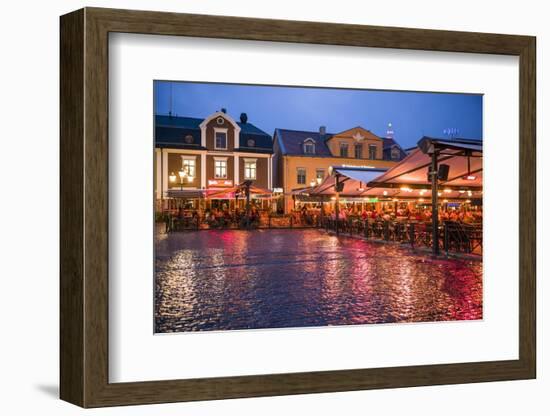 Sweden, Linkoping, cafes and bars on Stora target square, dusk-Walter Bibikow-Framed Photographic Print