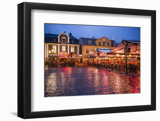 Sweden, Linkoping, cafes and bars on Stora target square, dusk-Walter Bibikow-Framed Photographic Print