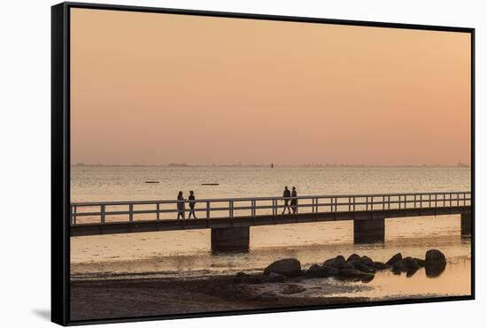 Sweden, Scania, Malmo, Riberborgs Stranden beach area, pier at sunset-Walter Bibikow-Framed Stretched Canvas