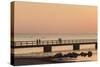 Sweden, Scania, Malmo, Riberborgs Stranden beach area, pier at sunset-Walter Bibikow-Stretched Canvas
