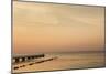 Sweden, Scania, Malmo, Riberborgs Stranden beach area, pier at sunset-Walter Bibikow-Mounted Photographic Print