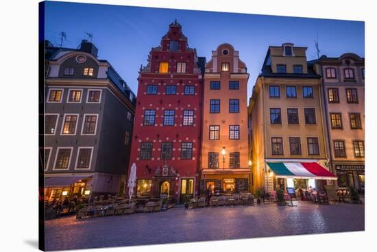 Sweden, Stockholm, Gamla Stan, Old Town, buildings of the Stortorget Square, dusk-Walter Bibikow-Stretched Canvas