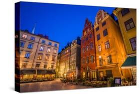 Sweden, Stockholm, Gamla Stan, Old Town, buildings of the Stortorget Square, dusk-Walter Bibikow-Stretched Canvas