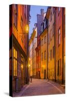 Sweden, Stockholm, Gamla Stan, Old Town, Royal Palace, old town street, dusk-Walter Bibikow-Stretched Canvas