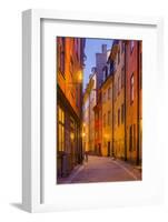 Sweden, Stockholm, Gamla Stan, Old Town, Royal Palace, old town street, dusk-Walter Bibikow-Framed Photographic Print