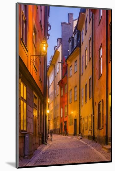 Sweden, Stockholm, Gamla Stan, Old Town, Royal Palace, old town street, dusk-Walter Bibikow-Mounted Photographic Print