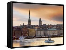 Sweden, Stockholm, Riddarfjarden, Gamla Stan, Passenger Ferries in Bay at Dusk-Shaun Egan-Framed Stretched Canvas