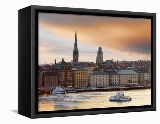 Sweden, Stockholm, Riddarfjarden, Gamla Stan, Passenger Ferries in Bay at Dusk-Shaun Egan-Framed Stretched Canvas