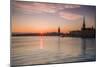 Sweden, Stockholm, Stockholm City Hall and Riddarholmen church, sunset-Walter Bibikow-Mounted Photographic Print