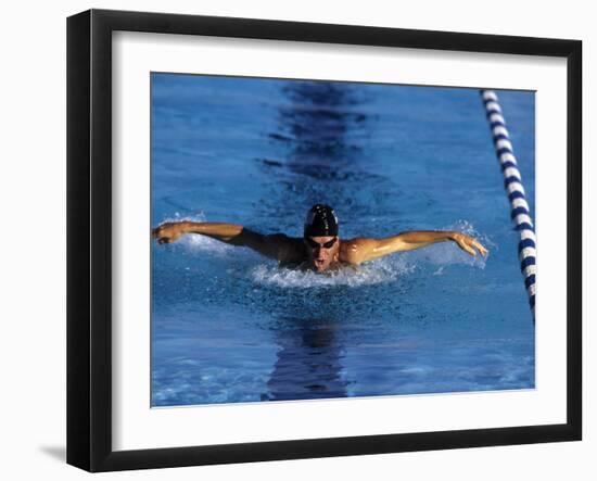 Swimmer Competing in a Butterfly Race-null-Framed Premium Photographic Print