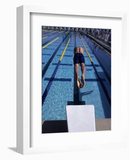 Swimmer Diving Off the Starting Blocks to Begin a Race-Steven Sutton-Framed Photographic Print