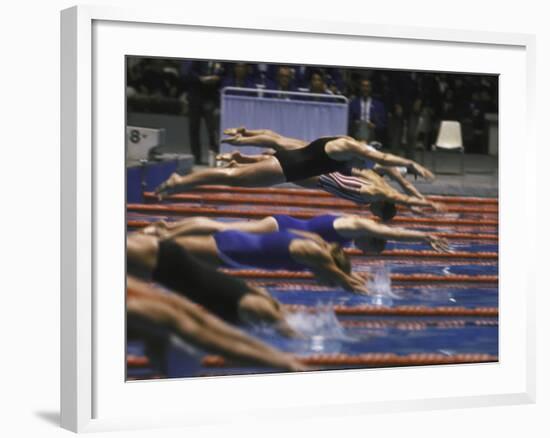 Swimmers Diving to Start a Race at Summer Olympics-null-Framed Photographic Print