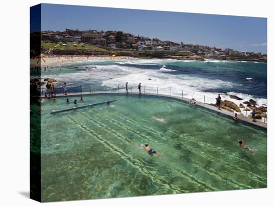 Swimmers Do Laps at Ocean Filled Pools Flanking the Sea at Sydney's Bronte Beach, Australia-Andrew Watson-Stretched Canvas
