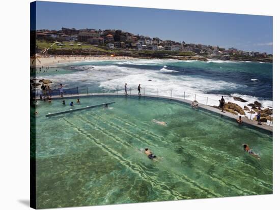 Swimmers Do Laps at Ocean Filled Pools Flanking the Sea at Sydney's Bronte Beach, Australia-Andrew Watson-Stretched Canvas
