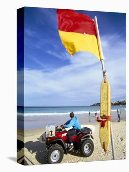 Swimming Flag and Patrolling Lifeguard at Bondi Beach, Sydney, New South Wales, Australia-Robert Francis-Stretched Canvas