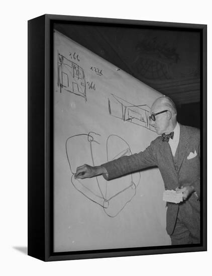 Swiss Architect Le Corbusier Standing on Stage with Notes in His Hand and Drawing on Sketch Pad-null-Framed Stretched Canvas