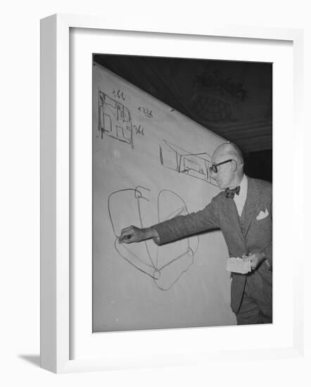 Swiss Architect Le Corbusier Standing on Stage with Notes in His Hand and Drawing on Sketch Pad-null-Framed Premium Photographic Print