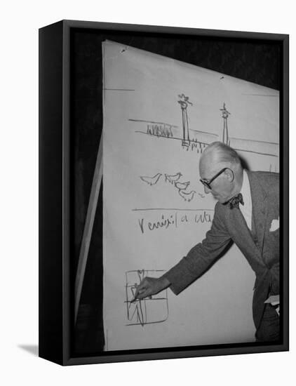 Swiss Architect Le Corbusier Standing on Stage with Notes in His Hand and Drawing on Sketch Pad-null-Framed Stretched Canvas