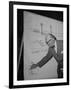 Swiss Architect Le Corbusier Standing on Stage with Notes in His Hand and Drawing on Sketch Pad-null-Framed Photographic Print