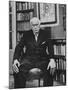 Swiss Psychiatrist Dr. Carl Jung Holding Pipe as He Sits on Chair in His Library at Home-Dmitri Kessel-Mounted Premium Photographic Print