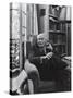 Swiss Psychiatrist Dr. Carl Jung Relaxing in an Easy Chair in His Library at Home-Dmitri Kessel-Stretched Canvas