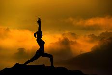 Silhouette of Woman Doing Yoga Meditation During Sunrise with Natural Golden Sunlight on Mountain-szefei-Laminated Photographic Print