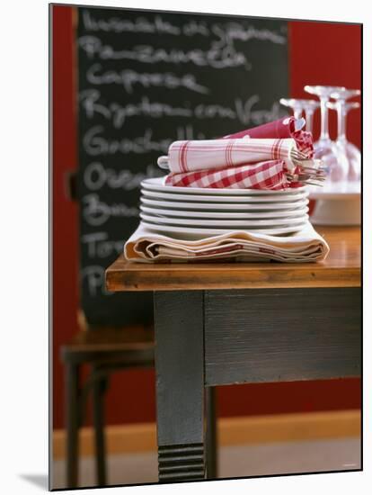 Table Linen: Fabric Napkins on a Pile of Plates-Jan-peter Westermann-Mounted Photographic Print