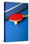 Table Tennis or Ping Pong Rackets and Balls on a Blue Table-Andreyuu-Stretched Canvas