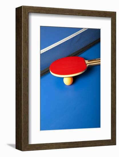 Table Tennis or Ping Pong Rackets and Balls on a Blue Table-Andreyuu-Framed Photographic Print