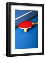 Table Tennis or Ping Pong Rackets and Balls on a Blue Table-Andreyuu-Framed Photographic Print